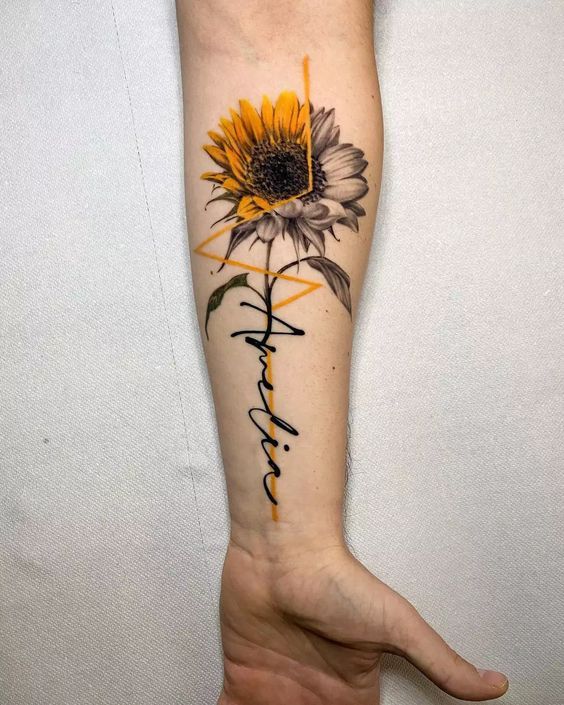 a sunflower with the word faith written in cursive writing on its arm