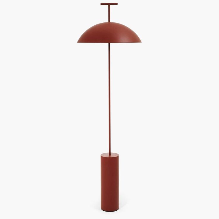 a red floor lamp with a brown shade on it's head and an orange base