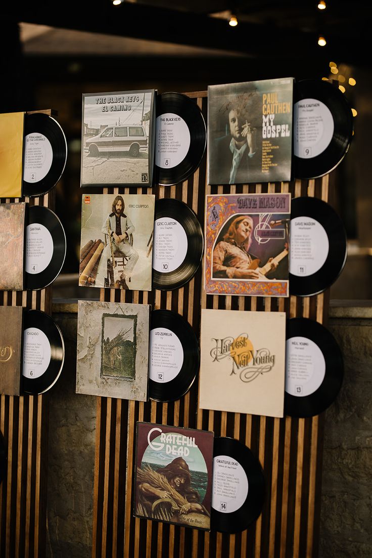 many records are on display in front of a wall