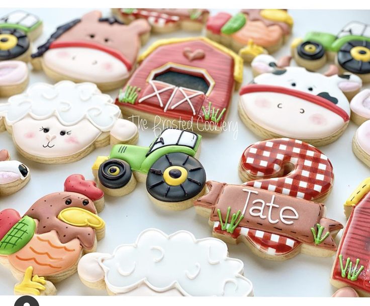 decorated cookies with farm animals on them and the words late written in large letters next to each cookie