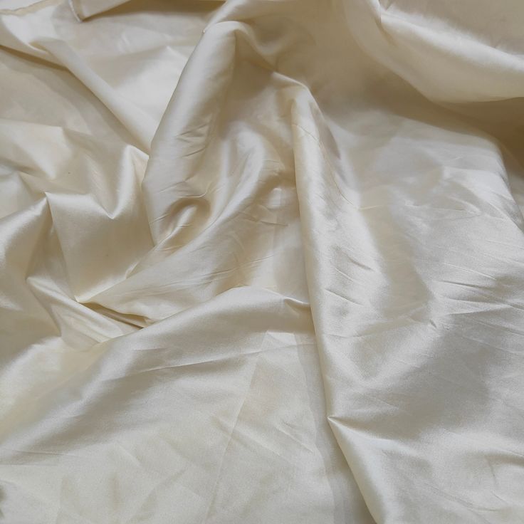 ♥♥Taffeta Fabrics♥♥ ⭐️Product Description⭐️ Quantity: ONE quantity Get 01 Yard and TWO quantity Get 02 Yards   Type: Handloom Content: Polyester Color: Ivory Quality: AAA Grade Length:- 01 Meter OR per yard basis... Edge: Straight Width: 58 inches Approx. Uses Formal Gowns, Wedding Dresses, Skirts, Lining,  Tops, Party Decorations, Festival, Costumes, Crafts, etc Ivory Taffeta Fabric, Plain Taffeta Silk Fabric, Gown Fabric, Ivory Color Polyester Taffeta Fabric For Bridal Dresses By The Yards PLEASE NOTE: Actual colors may appear a shade vary from those shown or two different due to the nature of photographing and dye lot variation or individual monitor settings on your mobile and computer.  ️If you're looking for an exact shade, we suggest buying a sample first.   ️If You need a Wholesale Tafetta Fabric, Dining Table Cloth, Taffeta Fabric, Festival Costumes, Silk Taffeta, Wedding Fabric, Ivory Color, Formal Gowns, Silk Fabric