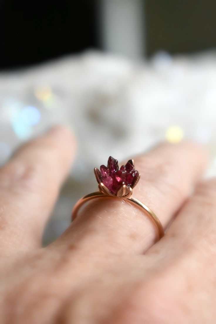 Spinel jewelry in 14K rose gold fill! Woweee I love this gemstone. A deep red Spinel gemstone lotus ring enveloped in pink gold. Spinel is known for its metaphysical energy renewal and vitality. It also closely relates to the Scorpio and Leo Zodiacs and also and August birthstone! Also called Ruby Spinel, it is the newest birthstone of August babies. Also available in sterling silver. This piece is ready to ship in a size 7. Or, hit the custom order button to have one made just for you, to size Unique Recycled Gold Gemstone Jewelry, Sterling Silver Spiritual Rings In Rose Gold, Rose Gold Sterling Silver Spiritual Rings, Spiritual Sterling Silver Rings In Rose Gold, Spiritual Sterling Silver Rose Gold Rings, Spiritual Rose Gold Sterling Silver Rings, Spiritual Rose Gold Ring Jewelry, Spiritual Style Rose Gold Ring, Dainty 14k Rose Gold Jewelry With Round Cut