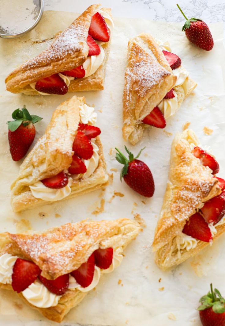 strawberry turnovers with powdered sugar and strawberries