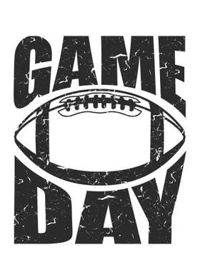 a football with the words game day written in black ink on a white paper background