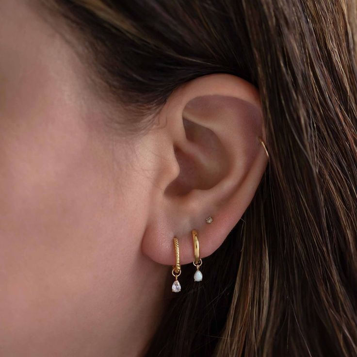 Adorn your everyday earrings with a touch of sparkle. Add our tiny charms to get even more out of your staple hoops. 14K Gold Moissanite DOES NOT FIT ALL EARRINGS, shop all matching earrings / singles Jumpring Inner Diameter 2.2mm Pear 5x3mm #CS056 tiny-pear-gemstone-earring-charm-moissanite-14k-gold tiny-pear-gemstone-earring-charm-opal-14k-gold Everyday Teardrop Huggie Earrings With Pearl Drop, Minimalist Teardrop Huggie Earrings For Anniversary, Dainty 14k Gold Dangle Huggie Earrings, Dainty Teardrop Huggie Earrings, Minimalist 14k Gold Teardrop Huggie Earrings, Everyday White Teardrop Huggie Earrings, 14k Gold Dangle Huggie Earrings For Everyday, Dainty Everyday Pearl Drop Huggie Earrings, Everyday 14k Gold Dangle Huggie Earrings