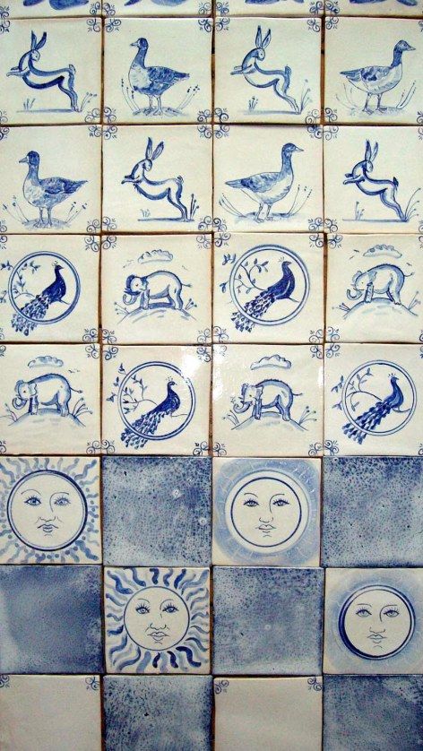 several blue and white tiles with different designs on them, all depicting animals in the same pattern