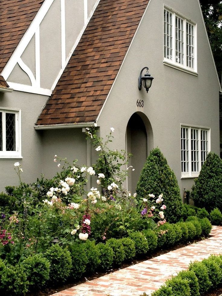 an image of a house with flowers and plants in the front yard that says internet