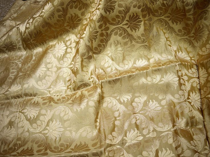 Beige Brocade Fabric Crafting Indian Brocade Fabric by the Yard Wedding Dress Banarasi Bridal Dress Material Sewing Leheng Blouses costumes. This is a beautiful heavy benarse blended silk brocade floral design fabric in Beige and Gold. ➤Product: Brocade Fabric ➤Fabric Type: Blended Silk (Viscose and Silk) Fine quality Zari Brocade Weaving from Banaras ➤Color: Beige and Gold ➤Width: 44 inches. ➤Condition: New ➤Code: bg1485 ➤Listing for 1 Yard of fabric. ➤Care: Dry Clean Only You can use this fabr Gold Banarasi Silk Embroidered Fabric For Wedding, Gold Wedding Embroidered Brocade Fabric, Gold Bollywood Style Brocade Embroidered Fabric, Banarasi Brocade Fabric Yellow, Festive Gold Brocade Embroidered Fabric, Yard Wedding, Lehenga Blouse, Silk Brocade, Brocade Fabric