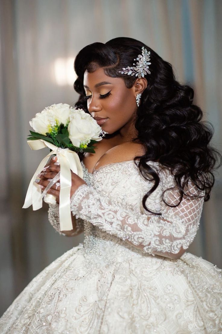 a woman in a wedding dress holding flowers