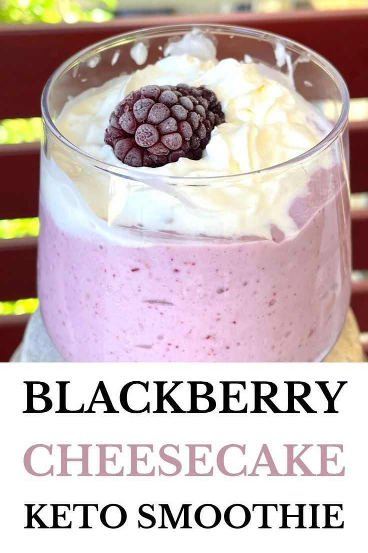 blackberry cheesecake keto smoothie in a glass with whipped cream and blackberries on top