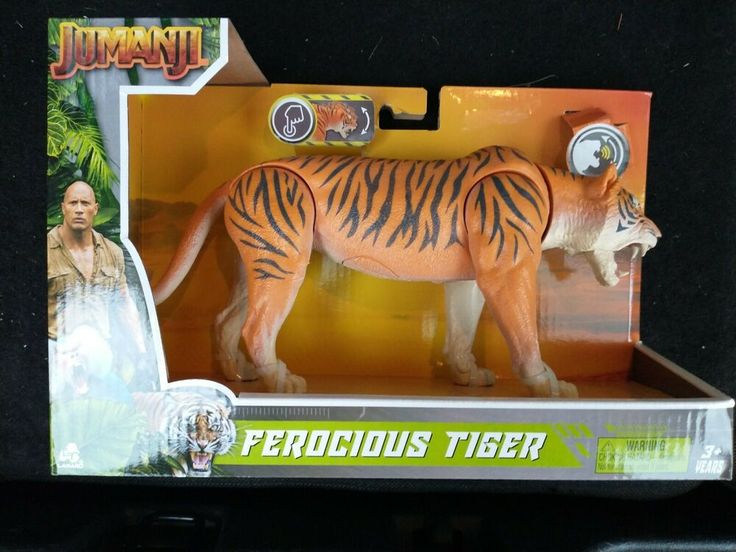 a toy tiger is in the box with its head turned to look like it's standing