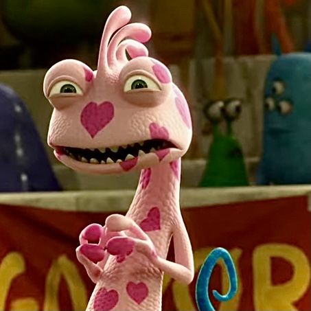 a cartoon giraffe with hearts on it's face and arms, standing in front of a banner