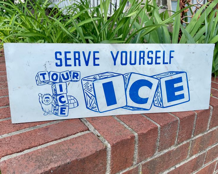 a sign on the side of a brick wall that says serve yourself to your ice