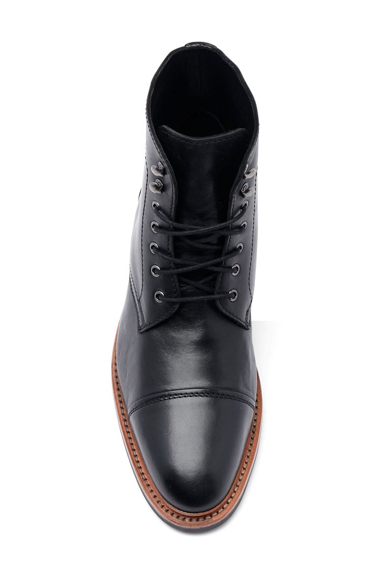 A cap toe and classic details add timeless appeal to this lace-up leather boot with a Goodyear welt stitched to a durable rubber tread. Leather upper and lining, rubber sole Imported Asian Owned/Founded Classic Lace-up Boots With Leather Lining And Round Toe, Classic Lace-up Boots With Round Toe And Leather Lining, Classic Moc Toe Winter Work Boots, Classic Moc Toe Work Boots For Winter, Business Lace-up Boots With Cap Toe For Winter, Classic Winter Work Boots With Reinforced Toe, Classic Work Boots With Leather Lining, Classic Lace-up Derby Boots, Classic Chukka Boots With Reinforced Toe For Fall