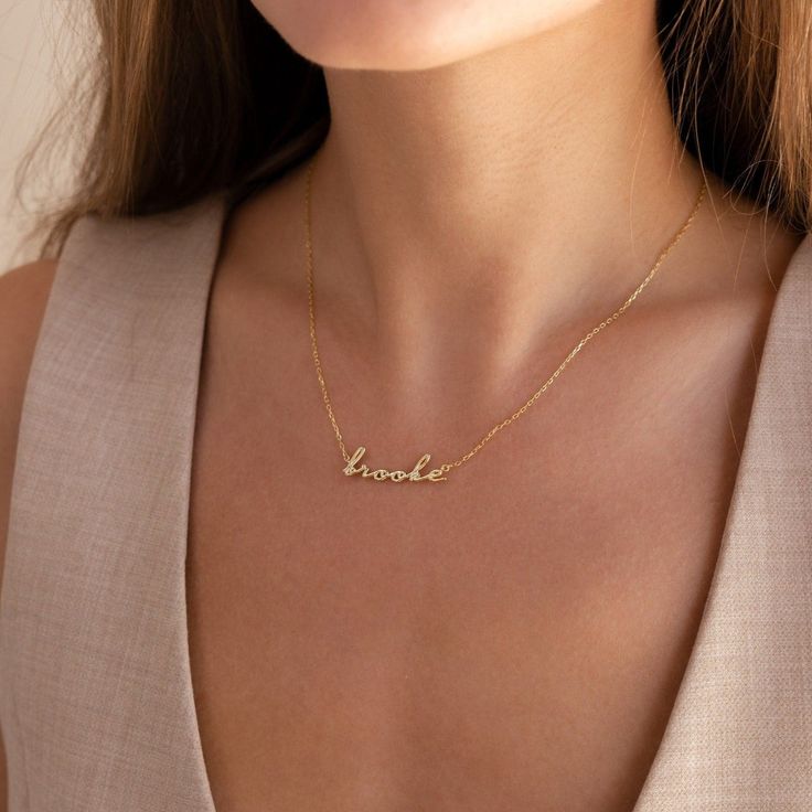 Our 3D Bubble Name Necklace is dainty and fun, perfect for a new mom in your life. Customize to the name that you want and show the person you care about them and their new adventures. With a delicate yet whimsical font, this nameplate necklace is what you need to add some personalization into your everyday jewelry. Material: High Quality Solid 925 Sterling Silver Finish: Sterling Silver ∙ 18K Gold ∙ Rose Gold Dimensions: Depending on your name, height sizes range from 3mm to 4mm lowercase Part Initial Tag Necklace, Whimsical Fonts, Fingerprint Necklace, Sideways Initial Necklace, Dainty Initial Necklace, Diamond Huggies, Art Deco Diamond Rings, Nameplate Necklace, Initial Pendant Necklace