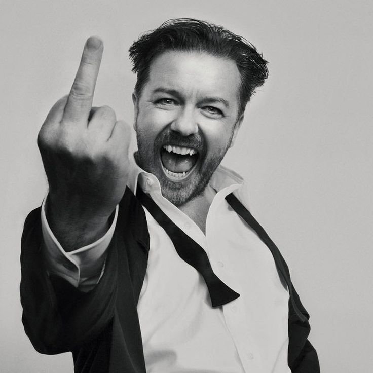 a black and white photo of a man making the middle finger sign