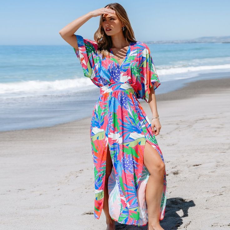 Embrace weekend vibes in the Bright Tropical Smocked Maxi Dress. Perfect for brunch with friends or a family gathering, its easy-going style and bright print make every day feel like a getaway. Whether you're attending a garden party or enjoying a beachside dinner, this versatile dress is your go-to choice for any warm-weather occasion. Product code: CAA05A4D165EE Beachy Short Sleeve Beach Dress For Brunch, Green Bohemian Beach Dress For Brunch, Casual Multicolor Print Dress For Beach Party, Casual Multicolor Print Vacation Dress, Blue Beach Dress For Vacation Brunch, Bohemian Beach Dress With Smocked Back For Vacation, Casual Multicolor Print Dress For Vacation, Beachy Beach Dress For Brunch, Summer Tropical Dress With Smocked Back