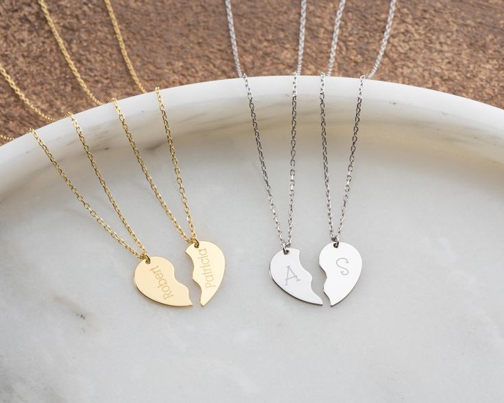 Celebrate your bond with this beautiful personalized broken heart necklace set, available in gold or silver. Each side of the heart can be engraved with initials or names, making it a perfect gift for couples, best friends, or family. The minimalist design is ideal for both everyday wear and special occasions, offering a meaningful way to stay connected to your loved ones. Materials: Available in solid gold, gold-plated, or sterling silver. Customization: Personalize each half of the heart with a name or initials (up to 10 characters per side). Chain Length: from 14" to 22". Perfect Gift: Ideal for birthdays, anniversaries, Christmas, or as a sentimental gift for her. Font Options: Choose from 14 unique font styles for your engraving. Font list available in the listing photos. Handcrafted Gift For Couples, Unique Fonts, Necklace Dainty, Sentimental Gifts, Stay Connected, Matching Necklaces, Dainty Jewelry, Gold Gold, Couple Gifts