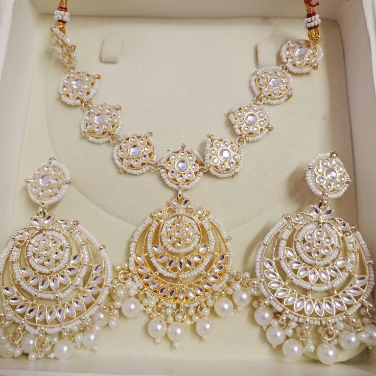 Title: "Exquisite Indian Jewelry: Kundan Necklace Set for Bridal Elegance" Step into the enchanting world of Indian tradition with our Kundan Necklace Set, meticulously crafted to adorn you with timeless elegance and grace. Inspired by the opulence of Indian weddings and the richness of ethnic bridal attire, this exquisite ensemble is a tribute to the beauty of tradition and culture. Indulge in the allure of our Ethnic Bridal Necklace, meticulously designed to complement your bridal attire with Wedding And Navratri Stone Work Sets, Bollywood Style Hand Set Tikka For Festivals, Eid Celebration Stone Work Tikka, Festive Kundan Anarkali Set For Weddings, Bollywood Bridal Sets For Wedding And Eid, Wedding Bridal Sets With Meenakari, Wedding Anarkali Set With Meenakari For Eid, Festival Wedding Anarkali Set In Kundan, Traditional Jewelry Sets For Eid Celebration