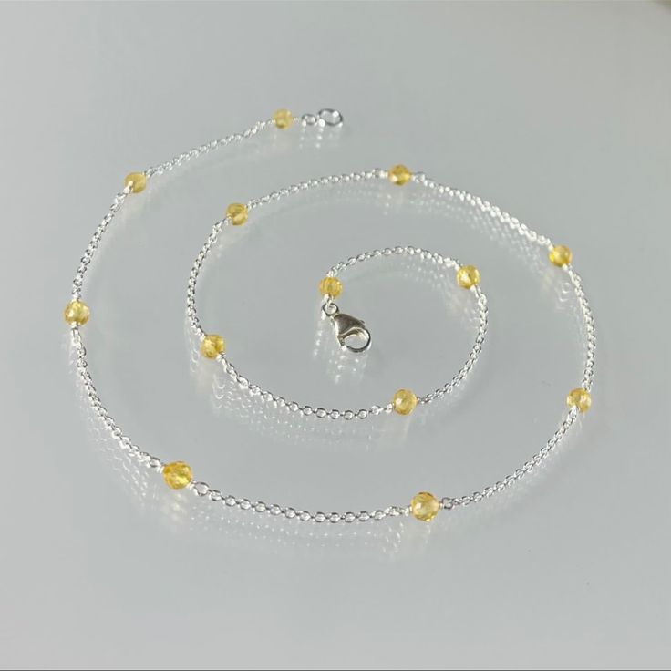 Gemstone: 3.5 - 4mm Genuine Citrine Faceted Cut Beads. Metal: Solid Sterling Silver. Length: 16” Inches ( Custom Length Is Available). Citrine Is November Birthstone. Citrine Sterling Silver Station Chain. Handmade With High-Quality Sterling Silver, This Elegant Chain Features Beautiful Citrine Gemstones Placed At Regular Intervals. The Citrine Stones Add A Touch Of Warmth And Sophistication To The Chain, Making It A Perfect Accessory For Any Occasion. The Sterling Silver Material Ensures Durabi Elegant Yellow Jewelry With Tiny Beads, Yellow Gemstone Beaded Necklaces For Gifts, Elegant Yellow Beaded Necklaces With Tiny Beads, Yellow Faceted Beads Necklace As Gift, Yellow Faceted Beads Necklace For Gift, Yellow Beaded Necklaces With Faceted Beads For Gift, Citrine Necklaces With Round Beads For Gifts, Citrine Round Bead Necklaces As Gift, Yellow Citrine Jewelry With Faceted Beads