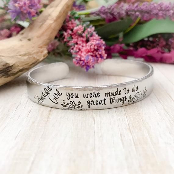 Beautiful girl. You were made to do great thingsMade from 6" aluminum. These cuffs are lightweight and can easily be worn with other bracelets. Available in 3/8" and 1/2" widths.Custom orders and sayings welcome!Looking for something else? Check out my other listings!https://www.etsy.com/shop/StampinStitchin?ref=seller-platform-mcnavTO WEAR:Slide sideways over the thinnest part of your arm, and turn so the opening is at the bottom of your wrist. While these will bend a bit to fit a variety of wr Inspirational Adjustable Hand Stamped Jewelry, Inspirational Stamped Jewelry For Best Friend Gift, Inspirational Hand Stamped Bracelets For Mother's Day, Inspirational Hand Stamped Jewelry For Best Friend, Inspirational Hypoallergenic Silver Bracelets, Adjustable Stamped Jewelry For Best Friend Gift, Inspirational Personalized Cuff Bracelet For Friendship, Silver Hand Stamped Cuff Bracelet For Personalized Gift, Inspirational Silver Cuff Bracelet