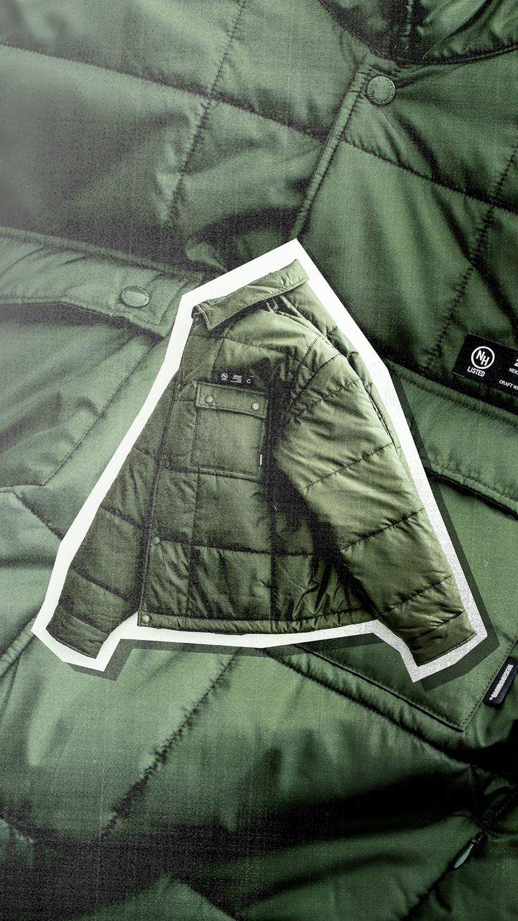 a green jacket with a white sticker on it