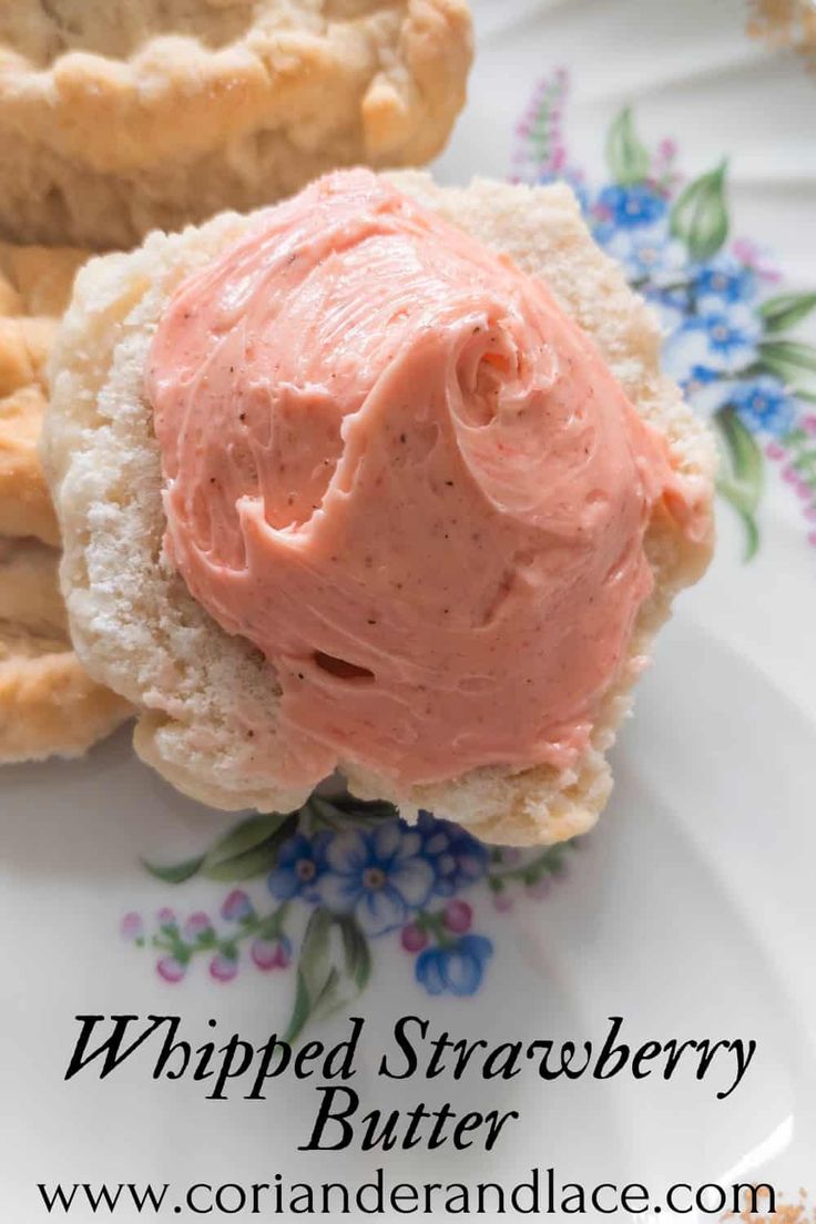 a close up of a sandwich on a plate with strawberry butter and pretzels in the background