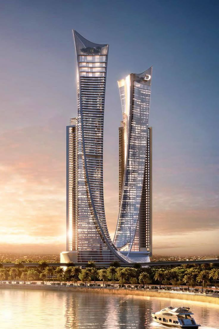 an artist's rendering of two futuristic skyscrapers rising above the water at sunset