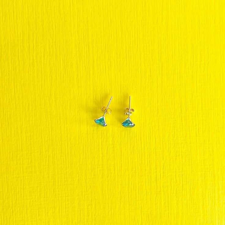 Breathtaking blue topaz symbolizes friendship. Those who wear it are known to be wise, kind, and motivating. These meaningful 14k solid gold blue topaz earrings make an excellent gift. DETAILS:Diameter: 6mmMaterial: 14k yellow goldStones: Blue Topaz Cubic ZirconiaClosure: Push Back Dainty Blue Earrings For Gifts, Tiny Blue Jewelry For Anniversary, Minimalist Blue Birthstone Earrings, Blue Topaz Minimalist Jewelry, Nickel-free Blue Topaz Earrings, Tiny Blue Minimalist Earrings, Tiny Blue Sterling Silver Jewelry, Dainty Blue Birthstone Earrings, Gift Blue Topaz Birthstone Earrings