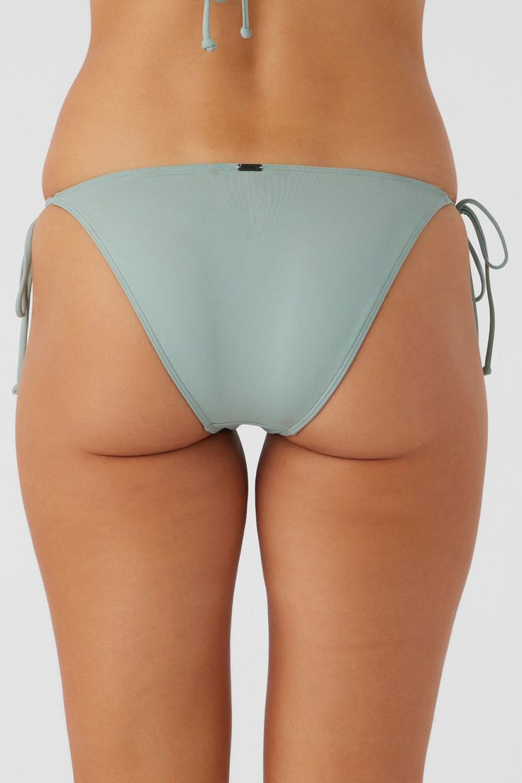 The beach is waiting. This is a solid color bikini bottom that has a classic side tie design and medium rear coverage fit. O'Neill Women's bikini bottom Saltwater Solids Collection Medium coverage Adjustable side ties O'Neill Blue: 85% Recycled Polyamide 15% Elastane Tactel | O'Neill Women's Saltwater Solids Maracas Tie Side Bottoms in Silver Blue, Size XL, Elastane/Polyamide Suits Series, Solid Color Bikinis, Loungewear Outfits, Spring Suit, Girl Beanie, Loungewear Dresses, Womens Wetsuit, Denim Sweater, Tie Design