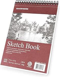 a spiral notebook with the words sketch book written on it and an image of a river