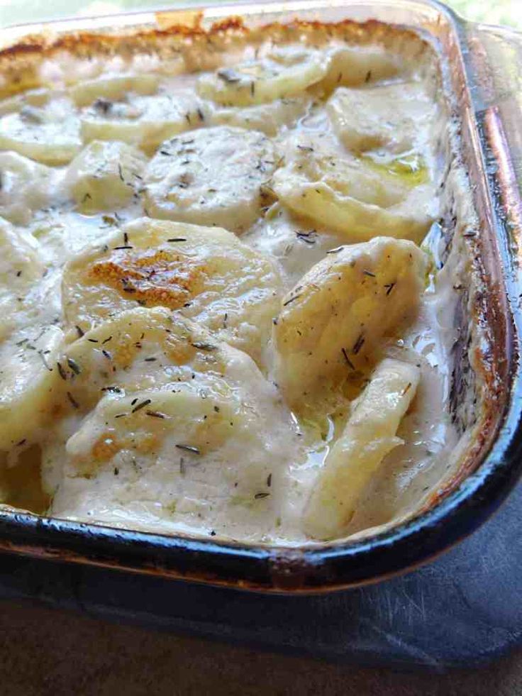 a casserole dish filled with potatoes and meat