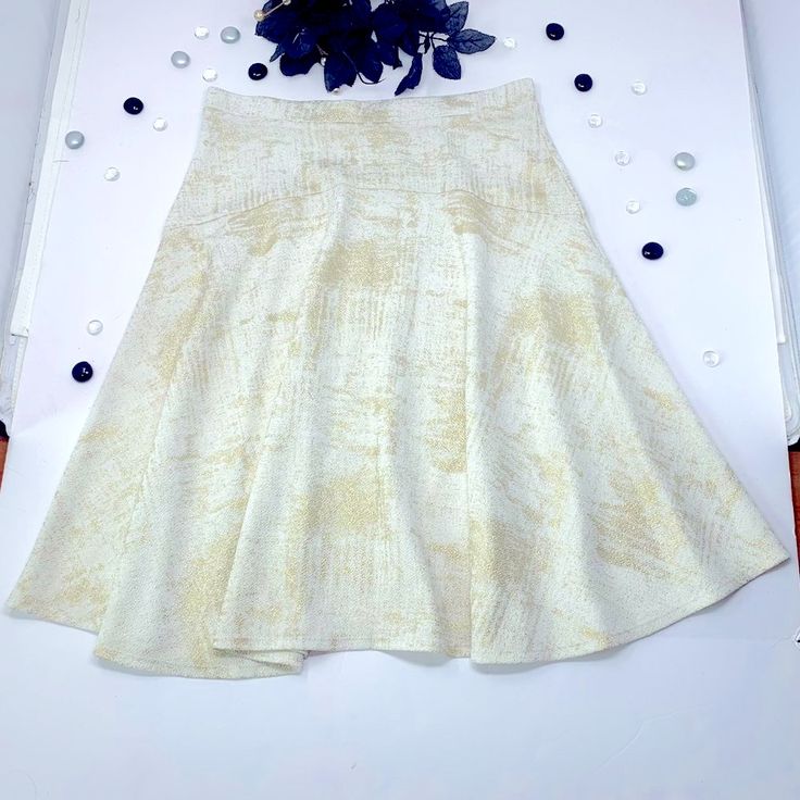 This Super-Soft, Flared Mini Skirt Features A High-Waisted, Skater Skirt Design, With A White And Gold Foil Holiday Print That Is Perfect For Day To Night And Dressing Up Any Outfit. Unlined, With Some Stretch. Style Many Ways. Exellent Condition, New And Never Worn. Fits Adults, One Size. Shown On Usa Size 8 Dress Form. Hand-Wash, Air-Dry Recommended. Sustainable Shipping, Plus Gift-Wrapping Available By Request. Ready To Ship. Features Super Soft, Flared Style. High-Waisted, Light Stretch. Whi Fitted A-line Maxi Skirt With Gathered Detail, Fitted A-line Maxi Skirt With Lining, White Relaxed A-line Skirt, White A-line Lined Skirt, White A-line Gathered Skirt, Cream Flared Skirt For Party, Fitted A-line Maxi Skirt For Spring, White Fitted A-line Bottoms, Fitted A-line Pleated Mini Skirt