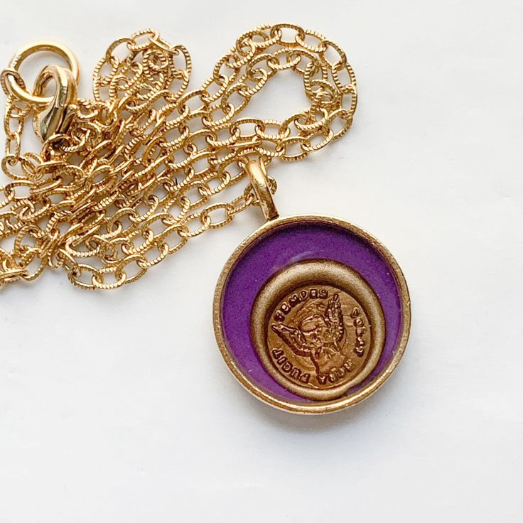 "Hourglass with Wings Wax Seal Necklace with Latin Sentiment The impression was made with a wax seal in my collection.  The TINY impression was taken in antique gold color sealing wax and it's rim was highlighted with authentic 18K gold pigment. The seal was then placed in a round bezel, backed with dark purple cardstock, and sealed in layers of clear glossy resin for protection.  ► * ◄ This charm features an image of an hourglass with wings surrounded by the words \"tempus volat, hora fugit\" Gold Necklaces With Antique Finish For Anniversary, Gold Stamped Jewelry For Commemoration, Antique Finish Gold Jewelry For Commemoration, Gold Antique Finish Jewelry For Commemoration, Keepsake Gold Stamped Jewelry, Gold Medallion Necklace With Stamped Detail, Gold Necklace With Antique Finish For Keepsake, Pewter Plates, Wax Seal Necklace