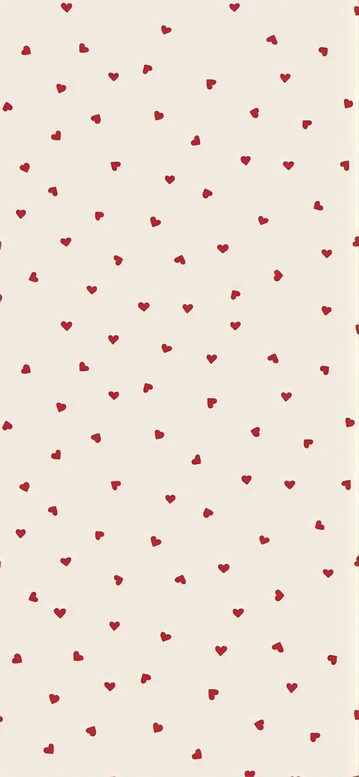 a white and red wallpaper with small hearts on the bottom half of it,