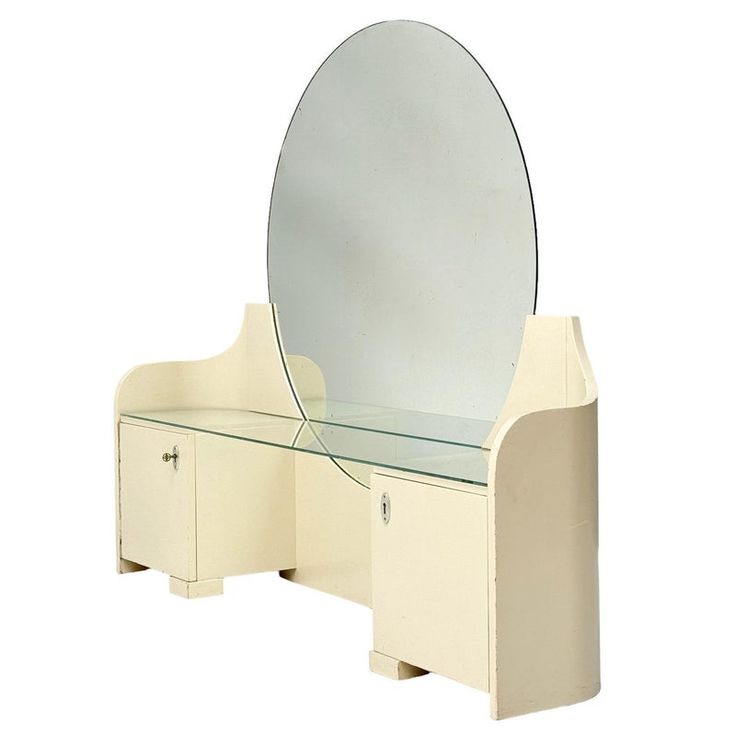 a white vanity with a mirror on it and drawers underneath the mirror is also a cabinet