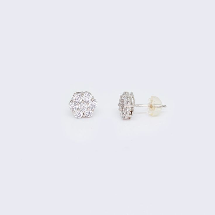 These 14K CZ Cluster Flower Stud Earrings are a stunning addition to any jewelry collection. Made with high-quality 14K white gold, these earrings are both durable and elegant. The intricate cluster flower design is adorned with sparkling cubic zirconia stones, adding a touch of glamour to any outfit. These earrings are perfect for any occasion, whether it's a formal event or a casual day out. The 14K CZ Cluster Flower Stud Earrings are a must-have for anyone who loves classic and timeless jewel Cubic Zirconia Bracelet, Cubic Zirconia Necklace, Flower Stud Earrings, Flower Stud, Cubic Zirconia Earrings, Cubic Zirconia Rings, Cz Earrings, Zirconia Earrings, Women Diamond