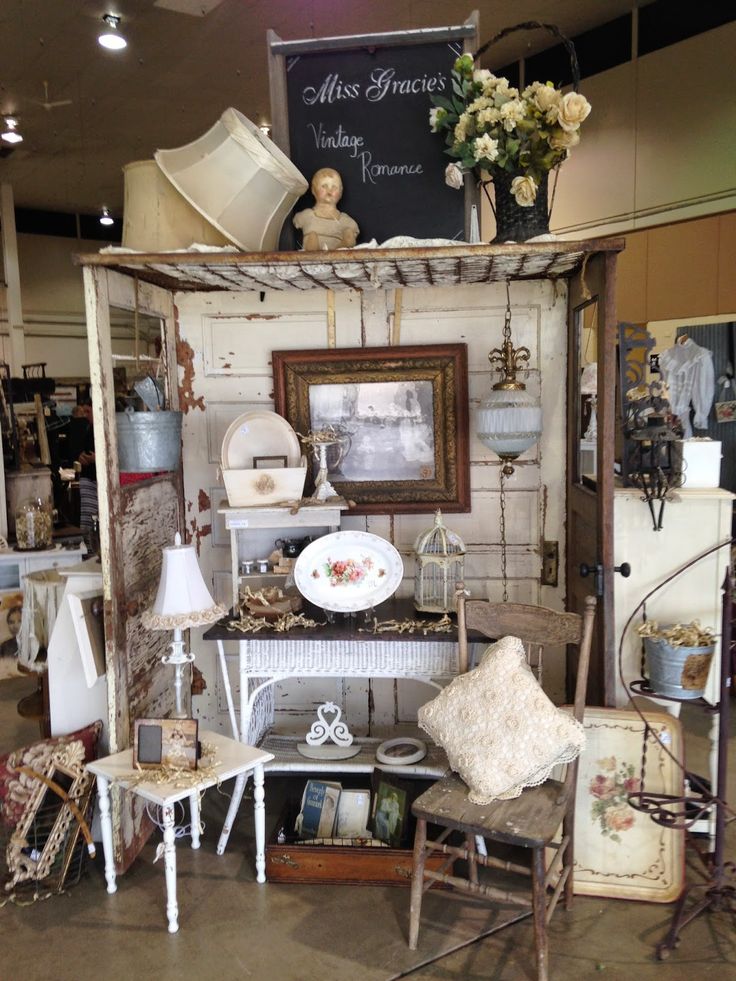 a room filled with furniture and decor inside of a store or showroom that is open to the public