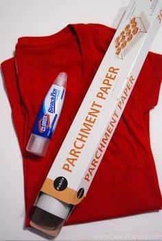 an orange shirt with a tube of toothpaste next to it