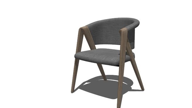 a gray chair sitting on top of a white floor