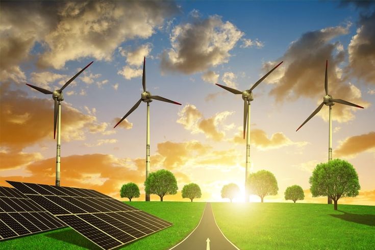 solar panels and wind turbines on a green field