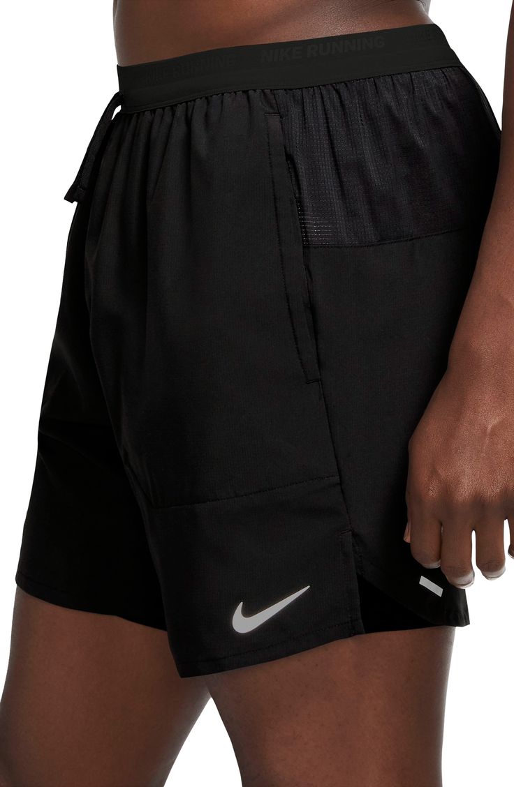 Flexible sweat-wicking fabric keeps up at any distance in high-performance running bottoms sporting interior compression shorts for breathable support. Pockets inside and out keep your tunes, keys and energy gels securely stowed and easy to reach. 6 1/2" inseam; 23" leg opening; 12" front rise; 14 1/2" back rise (size Medium) Interior compression short Reflective details enhance visibility in low light or at night Dri-FIT moisture-wicking technology 100% polyester with 94% polyester, 6% spandex contrast; 66% nylon, 34% spandex trim Machine wash, tumble dry Imported Compression Shorts, Low Light, Running Shorts, Keep Up, Nike Dri Fit, At Night, Dri Fit, High Performance, Moisture Wicking