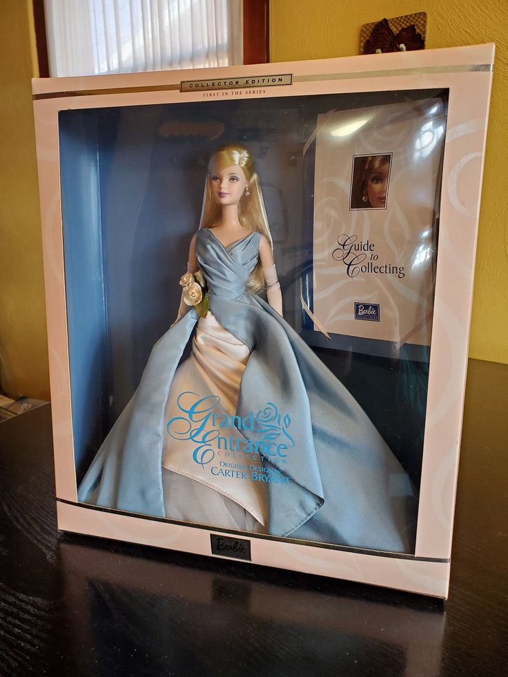 a barbie doll in a box on a table