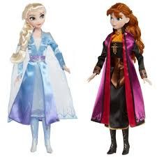 two frozen princess dolls standing next to each other