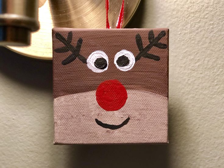 a christmas ornament hanging from the side of a wall