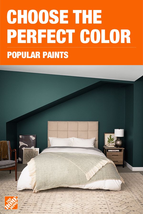 a bedroom with green walls and an orange poster above it that says choose the perfect color popular paints