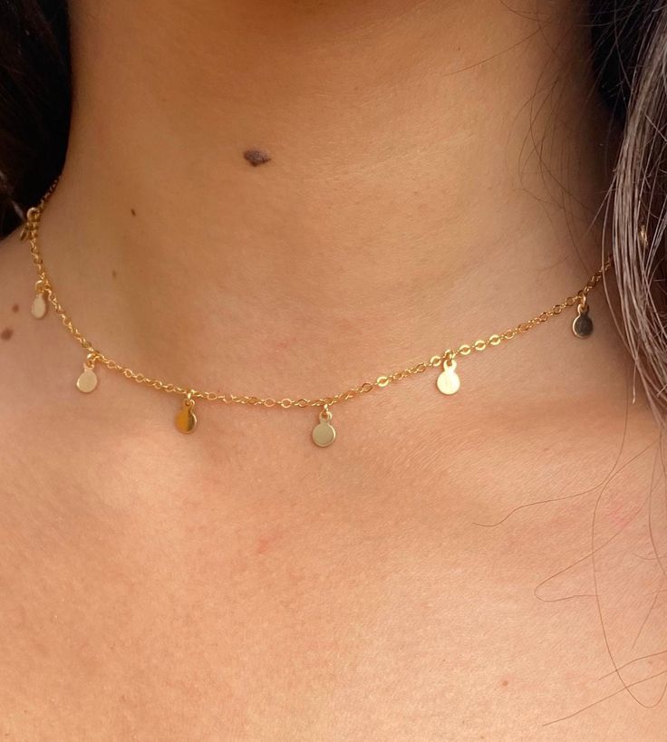 Circle charm choker  ✦ Details ✦ ✧ This necklace can be worn from 14-16 inches long. The chain is 14 inches long with a 2 inch extender. ✧ This necklace is available in sterling silver or gold filled. ✧ The circle charms are 4.25mm in diameter. ✦ ABOUT GOLD FILLED ✦ ✧ Gold filled is an actual layer of gold-pressure bonded to another metal. ✧ Gold filled does not flake off, rub off or turn colors. ✧ Most people with jewelry sensitivities can wear gold filled without worries of any allergic reacti Adjustable Delicate Chain Charm Choker, Adjustable Delicate Chain Choker Charm Necklaces, Delicate Adjustable Choker Charm Necklaces, Dainty Sterling Silver Choker With Delicate Chain, Simple Adjustable Choker Jewelry, Minimalist Sterling Silver Choker With Adjustable Chain, Minimalist 14k Gold Filled Chain Choker, Minimalist 14k Gold Filled Dangle Charm Necklace, Minimalist 14k Gold Filled Choker Chain Necklace