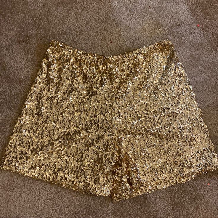 Gold Sequin Shorts - 4 1/2in Inseam -15in Across Unstretched Elastic Waistband. - Stretches 20in Across. Lined Inside. Never Worn Gold Stretch Bottoms Short Length, Short Stretch Sequined Bottoms, Gold High Waist Shorts For Party, Gold Stretch Shorts For Night Out, Stretch Sequin Short Bottoms, Stretch Sequined Short Bottoms, Gold High Waist Party Shorts, Stretch Sequin Shorts, Gold Stretch Short Bottoms