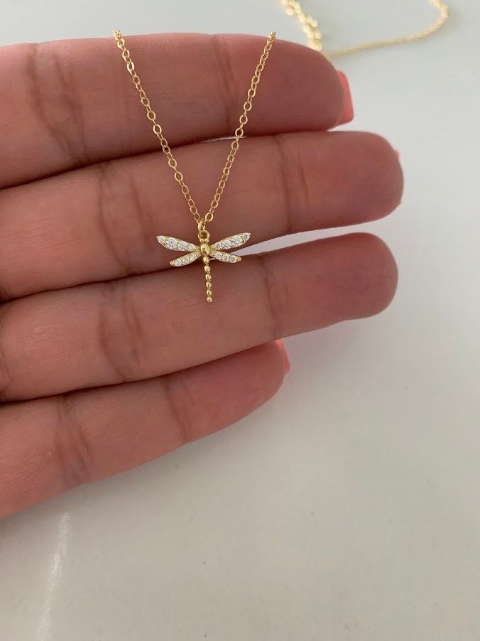 Floating Dragonfly Necklace, Dainty Dragonfly, Dragonfly Charm Pendant, Jewelry Gift for Her ♦ Materials: Gold, .925 Sterling Silver, Cubic Zirconia ♦ Available colors: Gold  ♦ Necklace measurements: 16" with a 2" extender, for a total adjustable length of 18". The chain is 1MM wide. The charm is 15MM x 12MM  ------------------------------------------------------------------------------------- MATERIALS All chains and pendants are made 925 Sterling Silver HOW TO FIND YOUR PERFECT FIT Your neck s Necklace Measurements, Pretty Jewelry Necklaces, Dragonfly Jewelry, Dragonfly Charm, Dragonfly Necklace, Dragon Fly, Dragonfly Pendant, Jewelry Accessories Ideas, Dope Jewelry