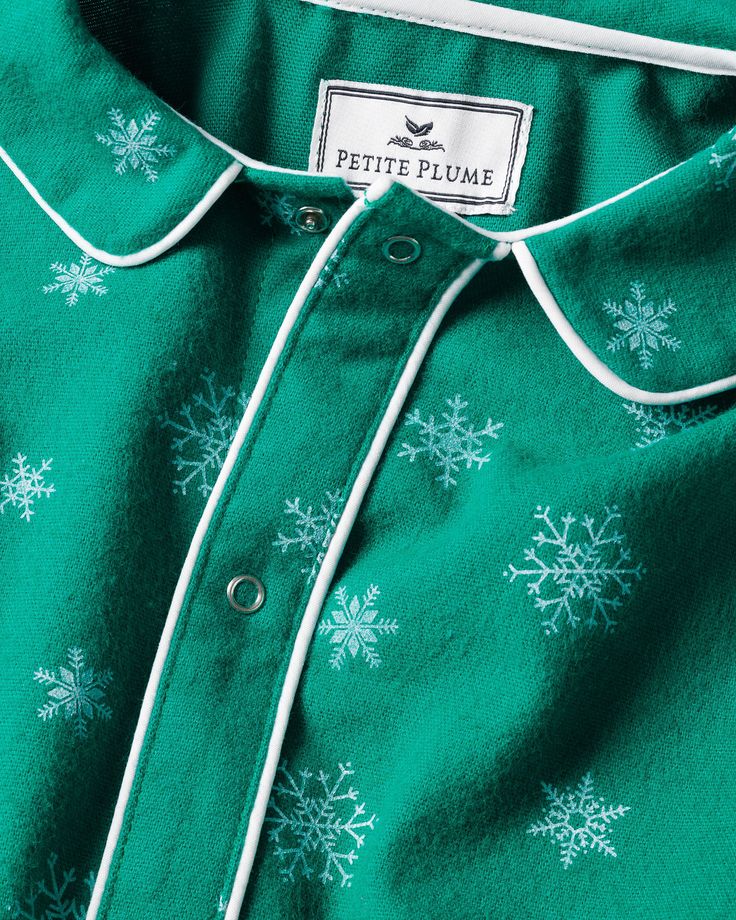 Admire wintry snowflakes without feeling any chill in the air. Flurries cover a striking emerald green flannel background, making this set a cozy hit for any holiday moment. Our Romper is made of the softest brushed lightweight, very soft flannel which will allow your little one to walk, crawl, or relax in comfort. Petite Plume debuted the first-ever chemical-free, flame-retardant fabric for children's sleepwear. Fine yarn-dyed cotton is blended with a touch of inherently flame-retardant fiber t Flannel Background, Baby Flannel, Luxury Sleepwear, Green Flannel, Loungewear Dresses, French Stripes, Cotton Pajama Sets, Fine Yarn, Linen Shop